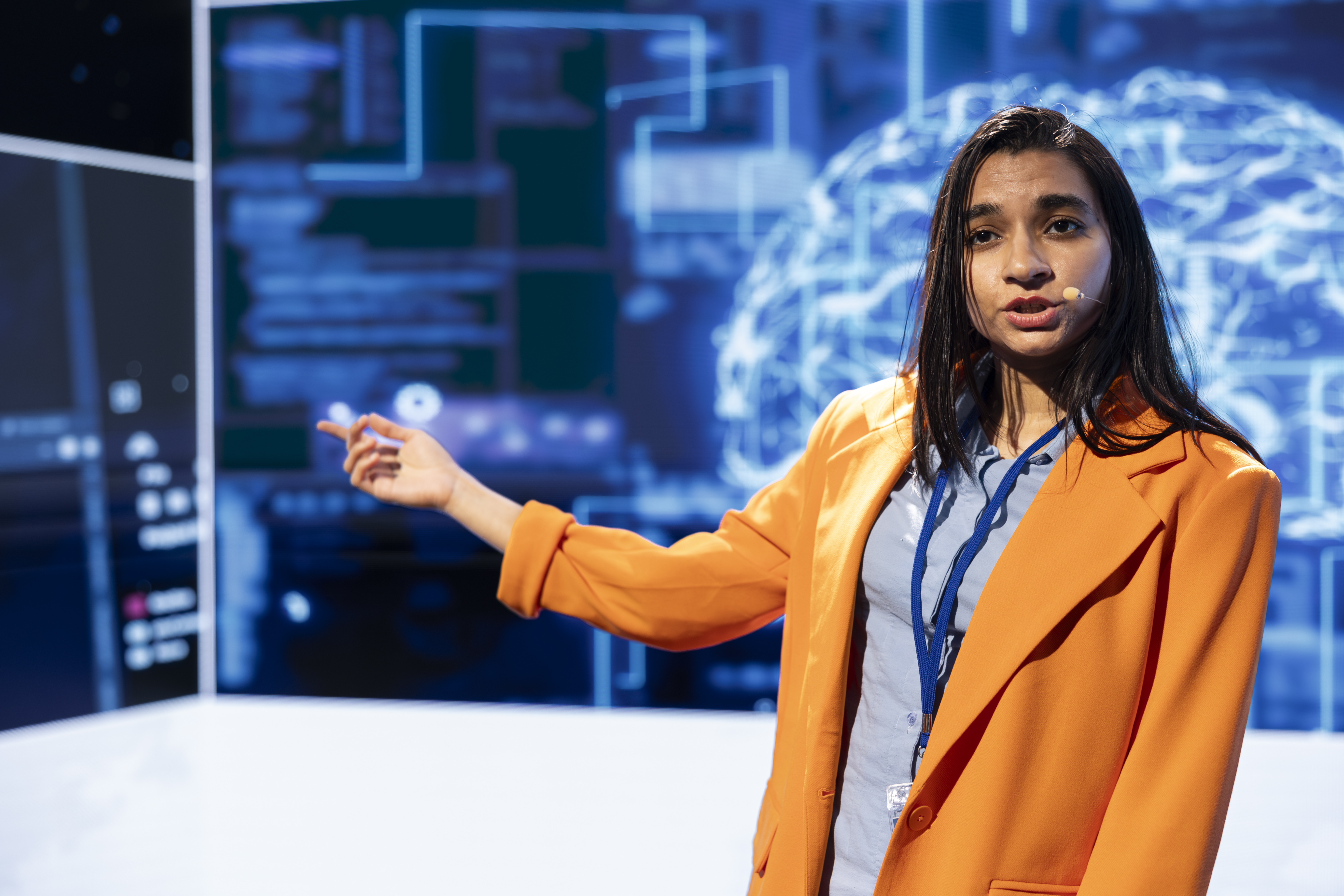 Speaker talking on stage in event bringing together leading specialists, researchers, innovators and companies from around the globe to explore latest developments in AI and machine learning